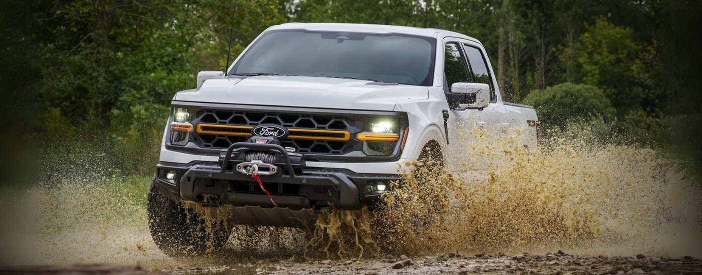 A silver 2025 Ford F-150 Tremor off-roading